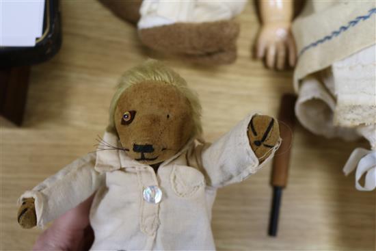 An early 20th century Bisque jointed doll with open mouth and sleeping eyes, and two small plush animals